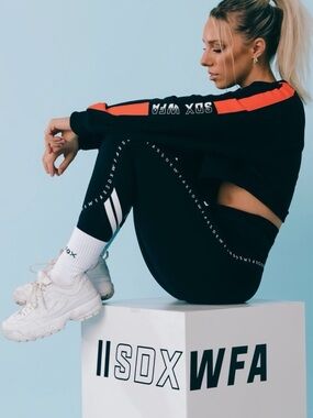 White Fox Boutique X Sarah’s Day Black Crop Sweatshirt with Orange Stripe